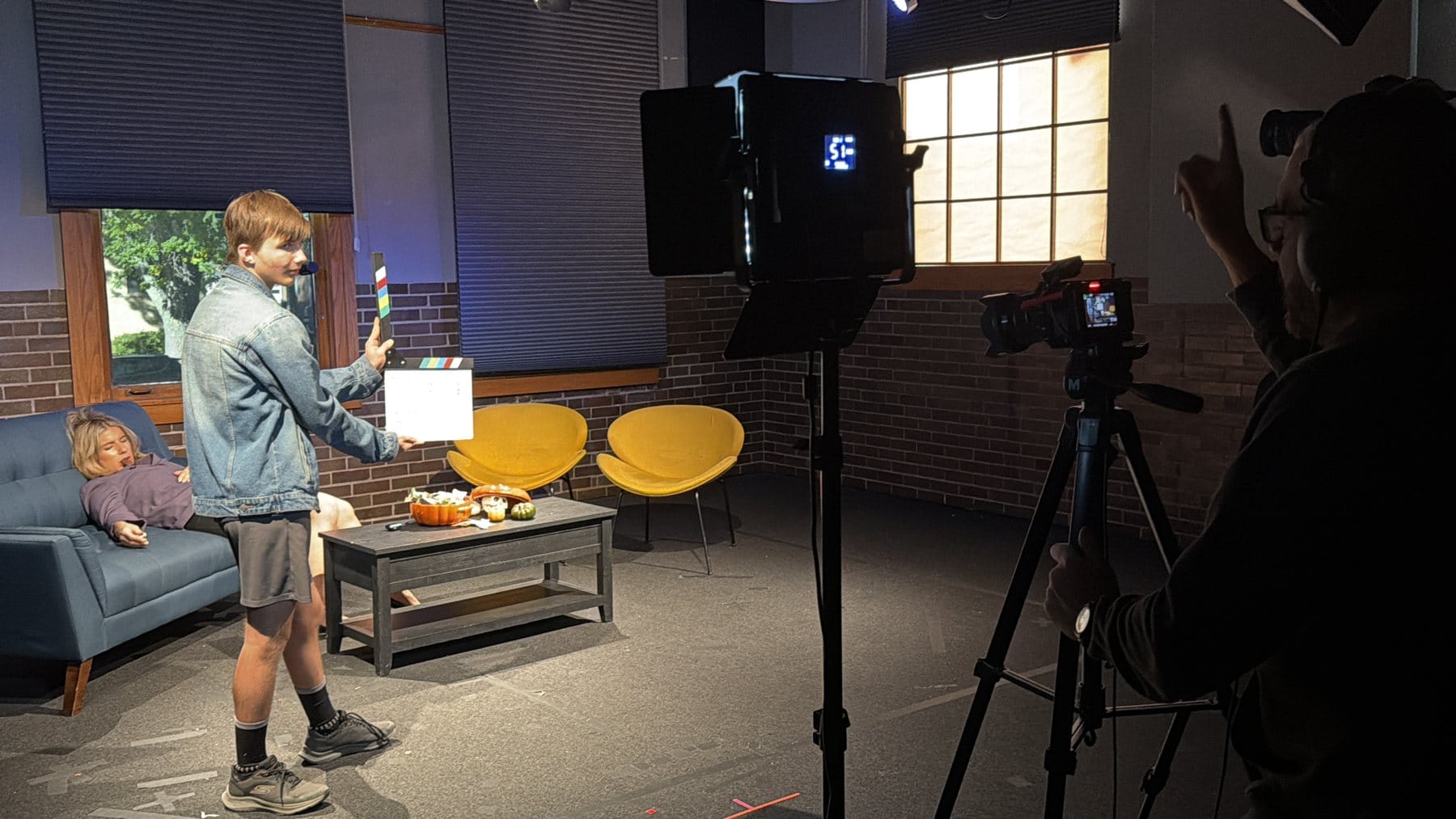 “Scene three, take one!” On the news set